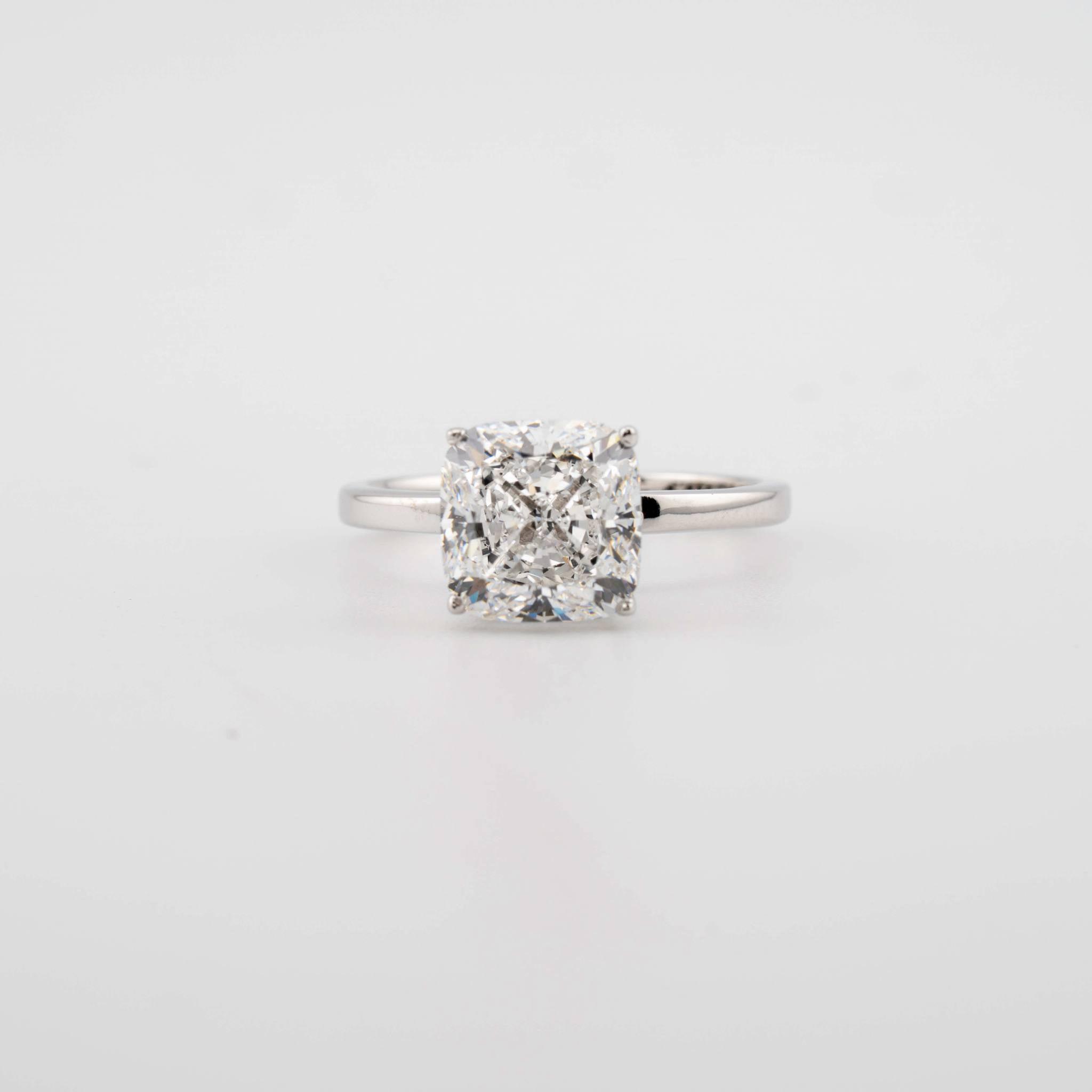 Cushion Cut Engagement Ring featuring a 4.10 ct diamond in 14kt white gold setting with VVS2 clarity.