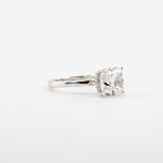 Cushion Cut Engagement Ring in 14kt white gold with a 4.10 ct center stone and side stones.